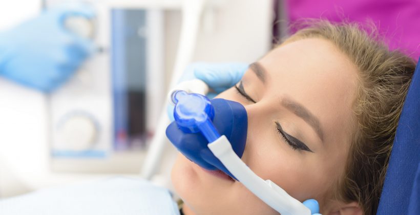 woman being sedated by nitrous oxide