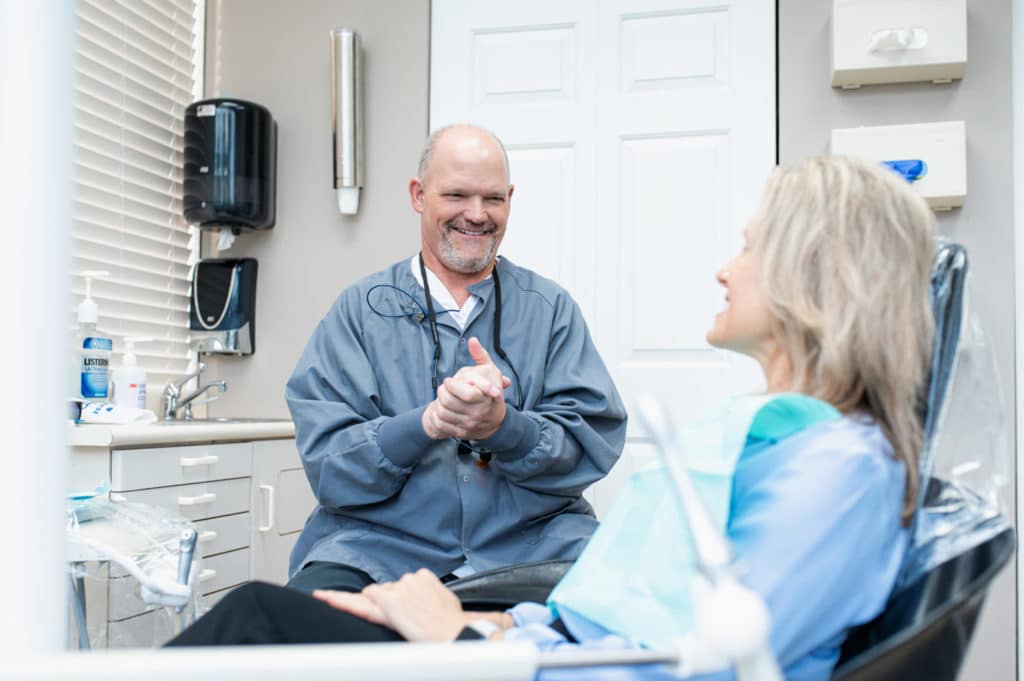 dr. mike rothan talking to a patient